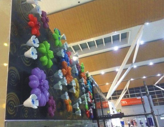 Close view of the sculpted flower wall in the terminal