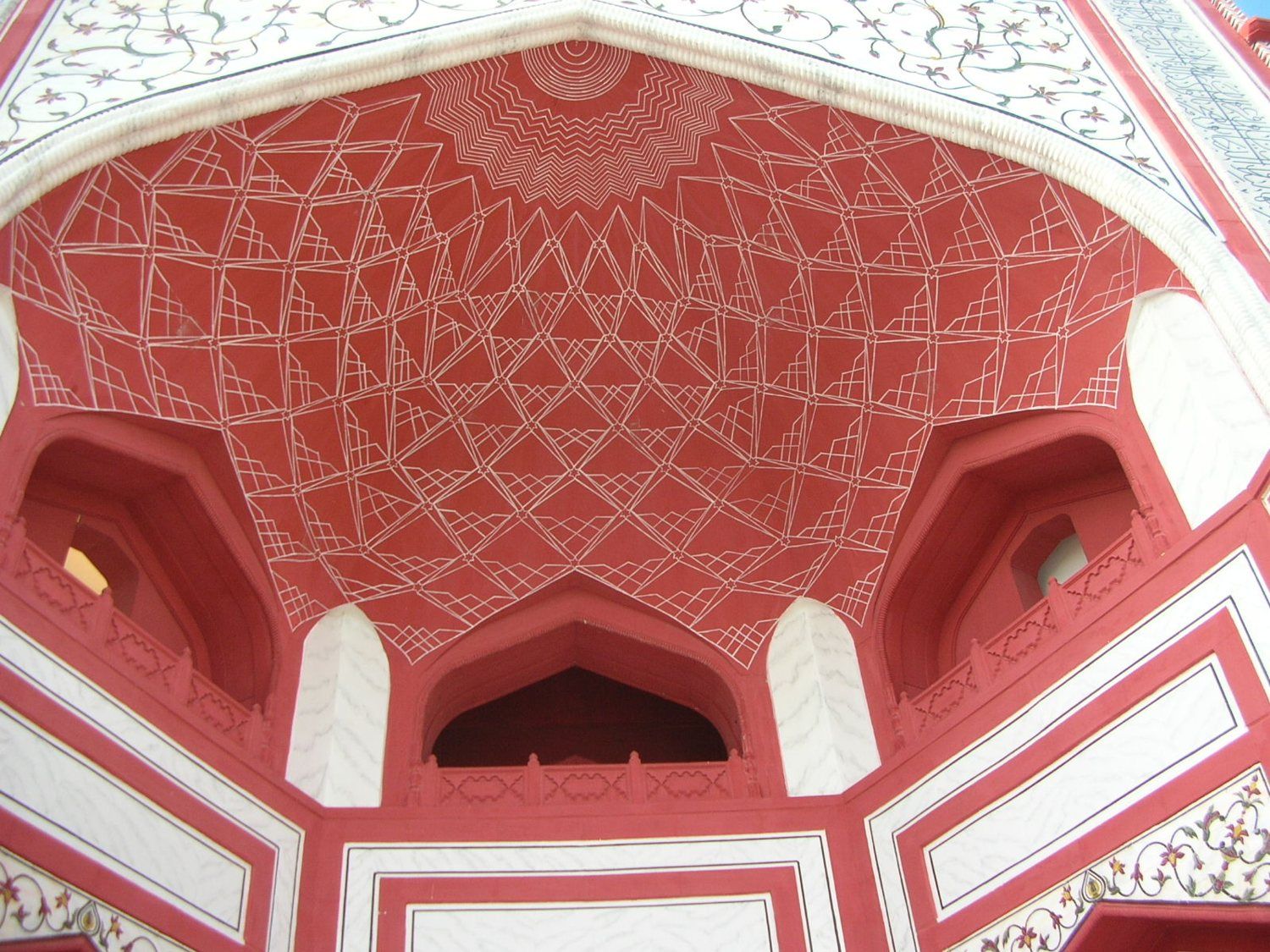 Red vaulted ceiling with white geometric pattern
